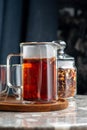 Herbal tea in french press. Hibiscus tea, Mixture herbal floral fruit tea with pieces of strawberry and red appl
