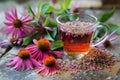 Herbal tea in glass cup with echinacea flowers on rustic wooden table Royalty Free Stock Photo