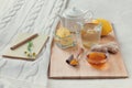 Herbal tea in glass cup with flowers of chamomile, turmeric and honey on a wooden board. Royalty Free Stock Photo