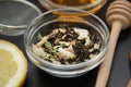 Herbal Acaccia Tea Healthy Drink in bowl and sieve over Black Background copy space. Healthy Drink, coldness.