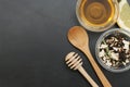 Herbal Acaccia Tea Healthy Drink in bowl and sieve over Black Background copy space. Healthy Drink, coldness.