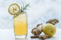 Herbal tea. Herbal tea with lemongrass and ginger with ice in a glass cup Royalty Free Stock Photo