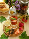 Herbal tea with herbs, lemon and strawberries Royalty Free Stock Photo