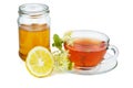 Herbal tea, jar of honey, lemon half and linden blossom