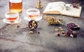 Herbal tea, old book and a watch on a chain Royalty Free Stock Photo