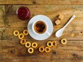 Herbal tea, raspberry jam and bagels on an old wooden table Royalty Free Stock Photo