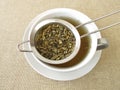 Herbal tea in tea strainer Royalty Free Stock Photo