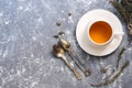 Herbal tea with thyme on a gray background. Tea in a white cup with herbs. Top view, copy space. Royalty Free Stock Photo