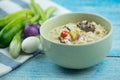 Herbed soya beans with minced pork in coconut milk served in white bowl Royalty Free Stock Photo