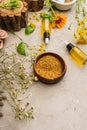 Herbs, bottles on concrete background, naturopathy