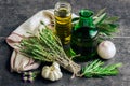Herbs: rosemary, thyme, bottles of olive oil and garlic Royalty Free Stock Photo