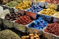 Herbs spices dried fruits menthol crystals blue dye at the old market in Dubai United Arab Emirates