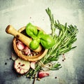 Herbs, spices, garlic and sea salt in a wooden mortar and pestle Royalty Free Stock Photo