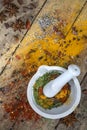 Herbs and spices and a mortar and pestle Royalty Free Stock Photo