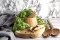 Herbs and Spices, Mortar and Pestle, wooden board, rosemary and basil, grey apron and wooden spoon Royalty Free Stock Photo