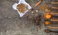 Herbs and spices on a wooden board. Spice spoon. Royalty Free Stock Photo