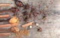 Herbs and spices on a wooden board. Spice spoon. Royalty Free Stock Photo