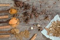 Herbs and spices on a wooden board. Spice spoon. Royalty Free Stock Photo