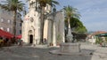 Herceg Novi, Montenegro - 31 June, 2017. Church St. Michael Archangel Herceg Novi with fountain nearby. High palm trees