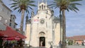 Herceg Novi, Montenegro - 31 June, 2017. Church St. Michael Archangel Herceg Novi. High palm trees. Old city fortress