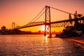 Hercilio luz bridge with warm sunset and bay waters in Florianopolis