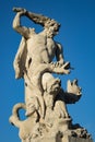 Hercules sculpture against the blue sky.