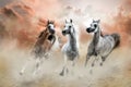 Herd of arabian horses galloping in the sand Royalty Free Stock Photo