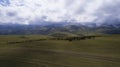 A herd of sheep grazing on a mountain green field Royalty Free Stock Photo