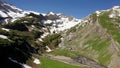 Yaks wading through a mountain river on the alp Geltenalp,