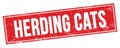 HERDING CATS text on red grungy rectangle stamp