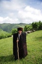 Herdsman in mountains Royalty Free Stock Photo