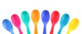 Eight colorful plastic spoons Royalty Free Stock Photo