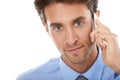 Always here to help. Studio shot of a young businessman talking a cellphone isolated on white. Royalty Free Stock Photo