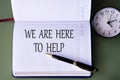 WE ARE HERE TO HELP - words in a white notebook on a dark green background with a clock Royalty Free Stock Photo