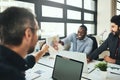 Here you go. a businessman handing a male colleague some documents. Royalty Free Stock Photo