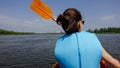 Canoeing on the river close to big city