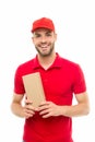 Here is your parcel. Ready to serve you. Man delivery service. Guy in red cap isolated on white background. Express Royalty Free Stock Photo