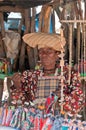 Herero woman in traditional German colonial dress and cow horn hat in front of her souvenir dolls stall, Namibia Africa Royalty Free Stock Photo