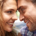 Heres looking at you. Closeup shot of a young couple sharing a tender moment while enjoying a day outside. Royalty Free Stock Photo