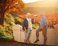 Heres to love that lasted a lifetime. a happy senior couple enjoying a glass of wine while exploring a vineyard.