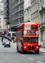 Heritage red Routemaster Bus operating in the City of London. Open platform at back facilitated speedy boarding under Royalty Free Stock Photo