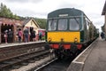 Heritage restored diesel train at railway station platform with Grosmont destination displayed. North Yorkshire Moors Railway