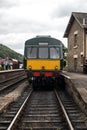 Heritage restored diesel train at railway station platform with Grosmont destination displayed. North Yorkshire Moors Railway