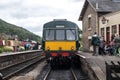 Heritage restored diesel train at railway station platform with Grosmont destination displayed. North Yorkshire Moors Railway