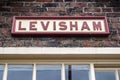 Heritage restored railway station signal box platform building with Levisham station sign displayed. North Yorkshire Moors Railw