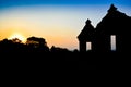 Silhoutte of ruins of ancient royal palace temple in the sunset evening in South East Asia