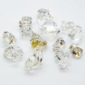 Herkimer gemstones with oil inside put on a white surface