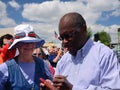 Herman Cain Signs Autograph