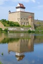 Herman Castle with a reflection on a sunny August day. Narva. Estonia Royalty Free Stock Photo