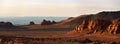 Herman Cav Canyon at sunset. South Gobi, Mongolia. Herman Tsav Canyon. Red Sandstone plateau, Martian landscape.